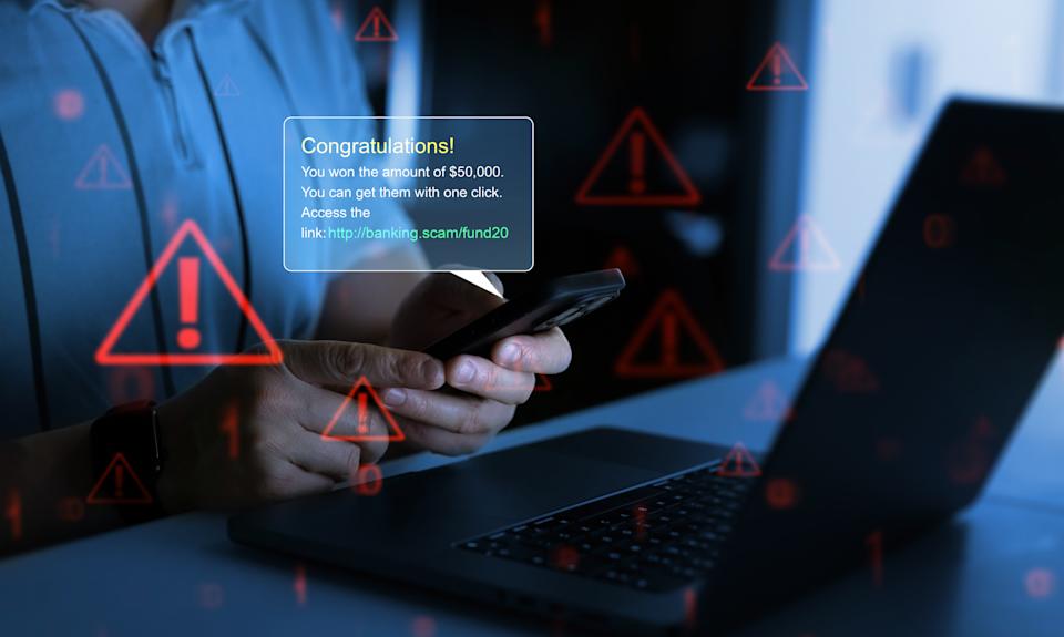 Bank fraud through phone messages.Businessman holding phone with scam message on digital screen. Fake text SMS scam.Scammers online.Cyber scam