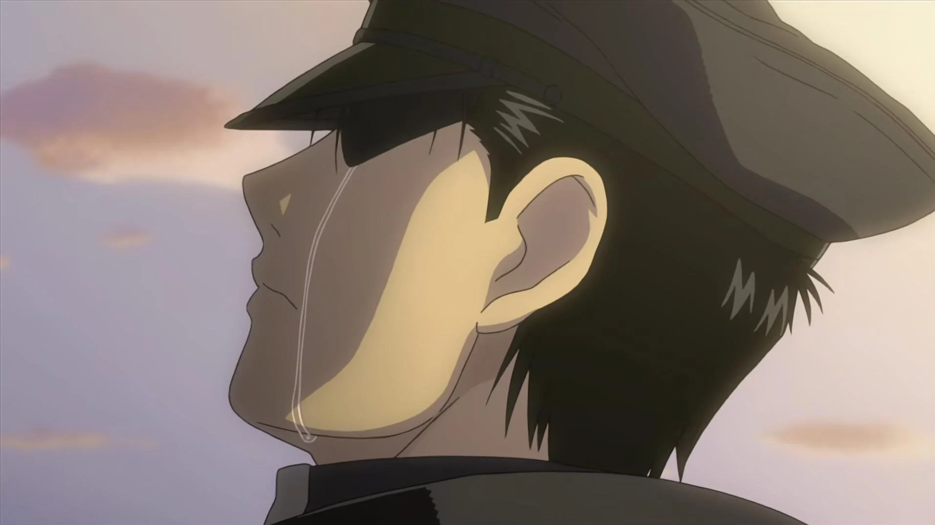 Fullmetal Alchemist Brotherhood still of Roy Mustang crying. 