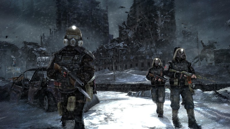 Three figures wear masks and armor while wielding guns in a snowy, ruined city.