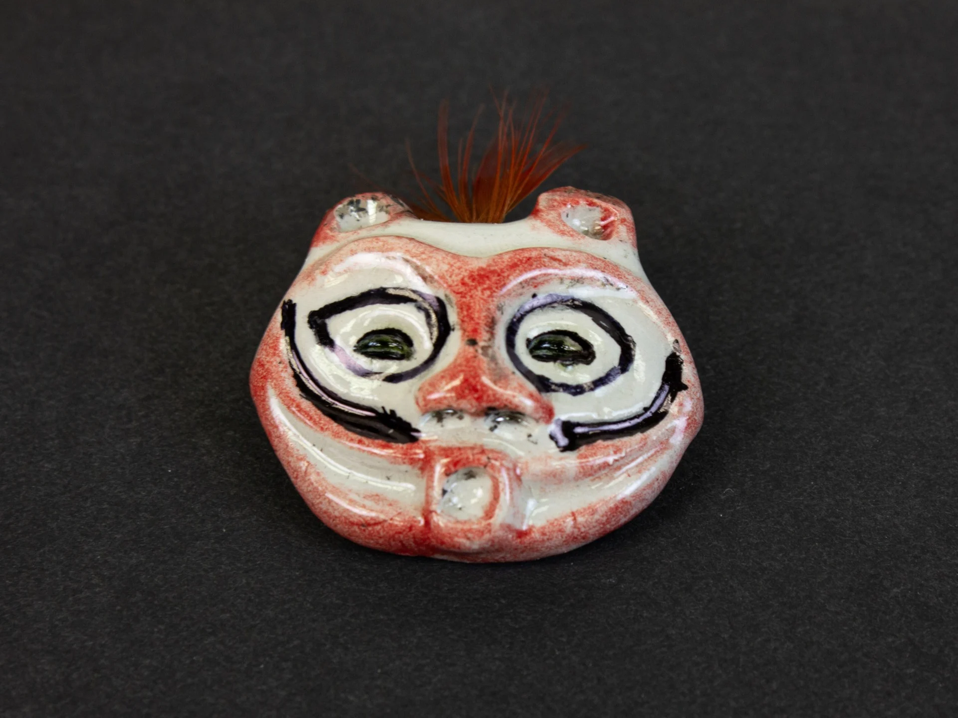 Oregon's contribution to the America 250 time capsule, a “She Who Watches” pin handcrafted by acclaimed Native American artist Lillian Pitt.