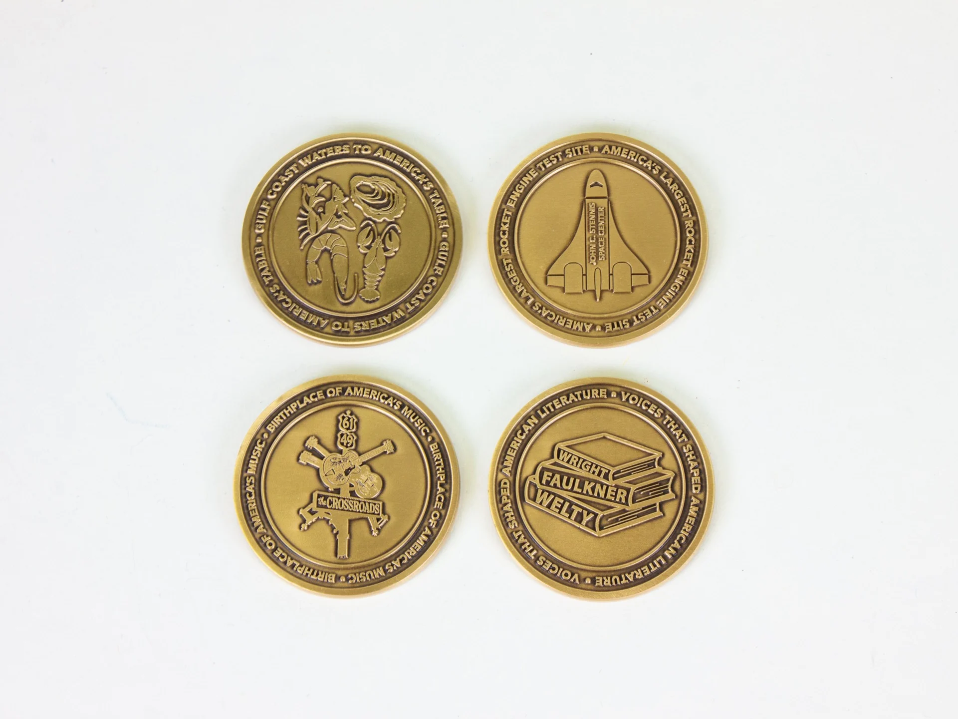 Four brass coins included by the state of Mississippi in the America 250 time capsule, which will be buried on July 4, 2026.